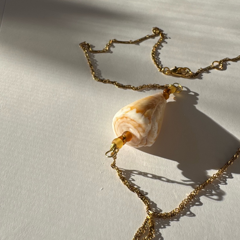 Handcrafted adjustable gold cone shell necklace with brown beads